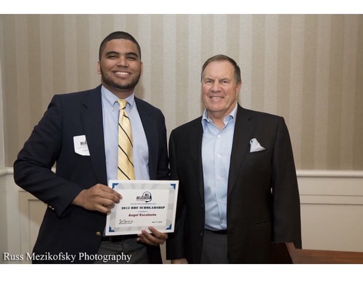 Angel receiving a scholarship from the Bill Belichick Foundation.