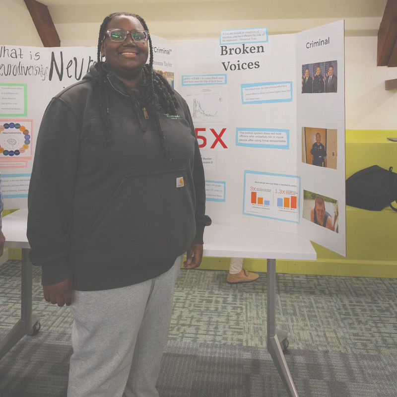 student presenting research and advocacy project