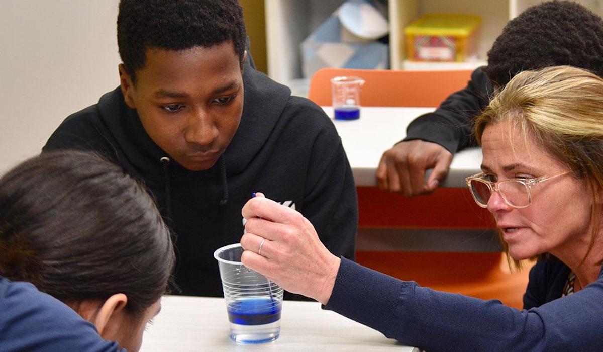 students doing science experiment