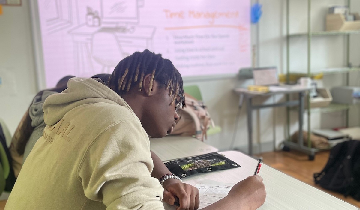 students in class listening to teacher