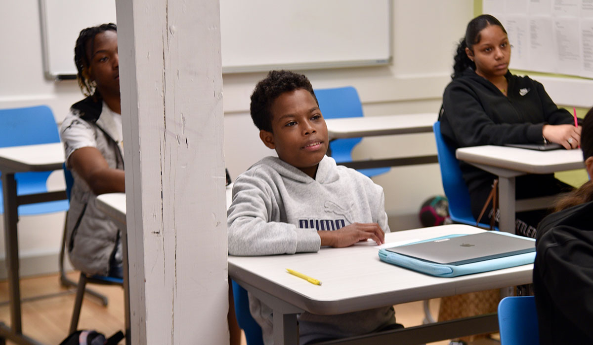 students in class listening to teacher